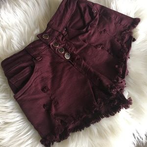 Maroon colored jean shorts